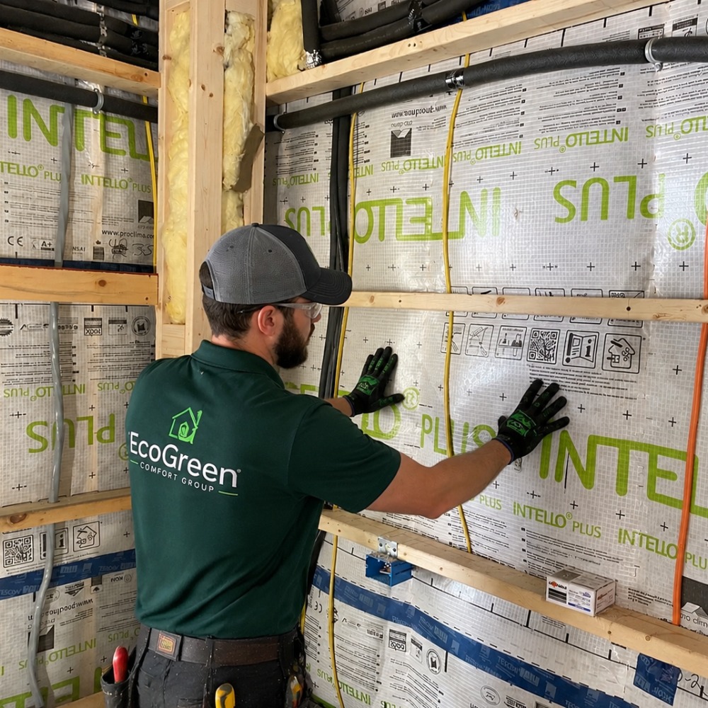 EcoGreen Comfort Group technician installing Intello Plus air barrier during air sealing service in Denver, NC